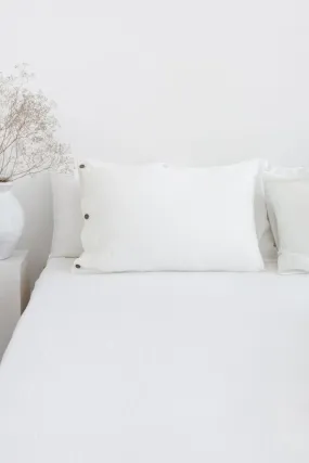 White linen pillowcase with coconut buttons