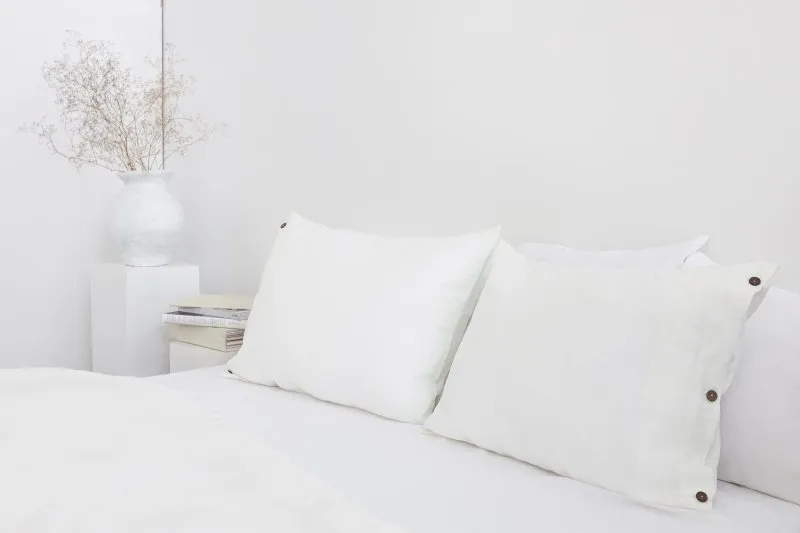 White linen pillowcase with coconut buttons